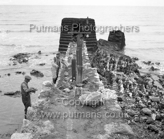 Ref 2602 Albion Breakwater - Les Wall repairing damage 1953