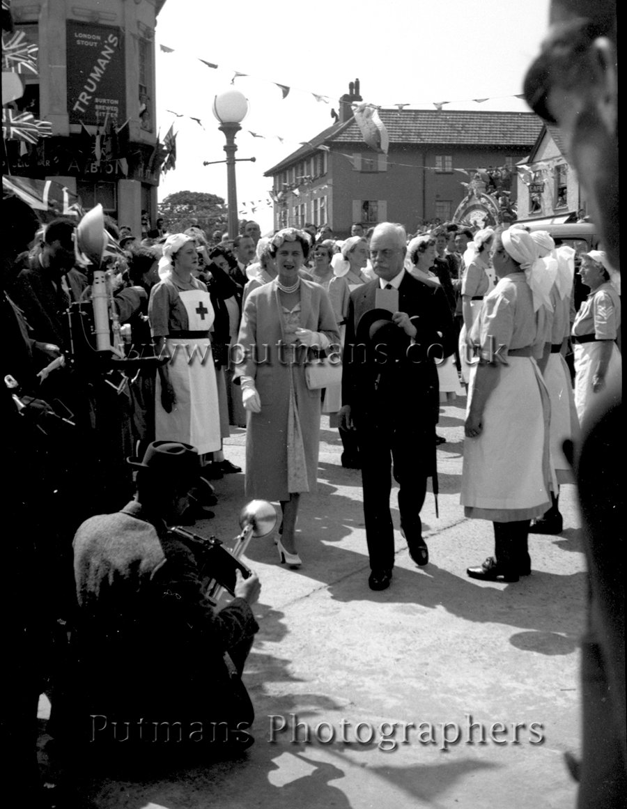 Ref 02 The Duchess moves through the guard of honour. Note the press camera men