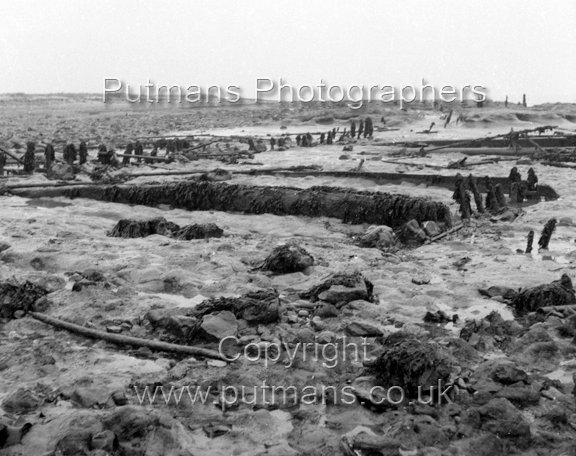 Ref 2003 Ancient wooden structure uncovered by sea at The Low 1963