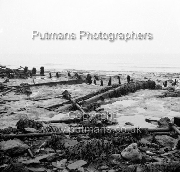 Ref 2004 Ancient wooden structure uncovered by sea at The Low 1963