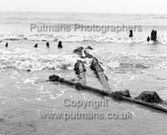 Ref 2018 Ancient wooden structure uncovered by sea at The Low 1963