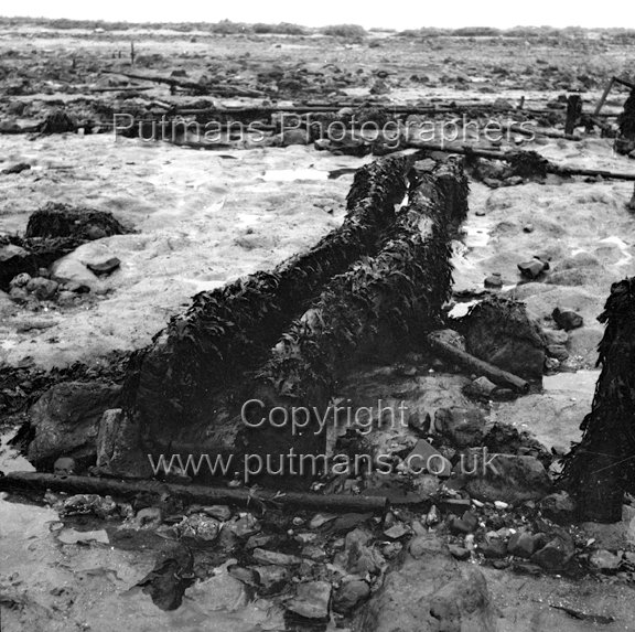 Ref 2020 Ancient wooden structure uncovered by sea at The Low 1963