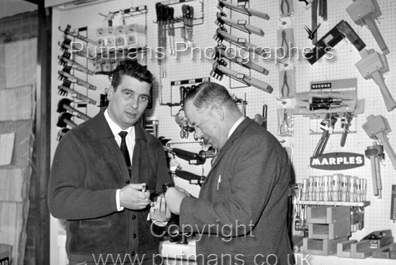 Ref OF672 Doug Hartley (owner) with Tom Gray (assistant) in new Hartleys store 26th Jan 1967