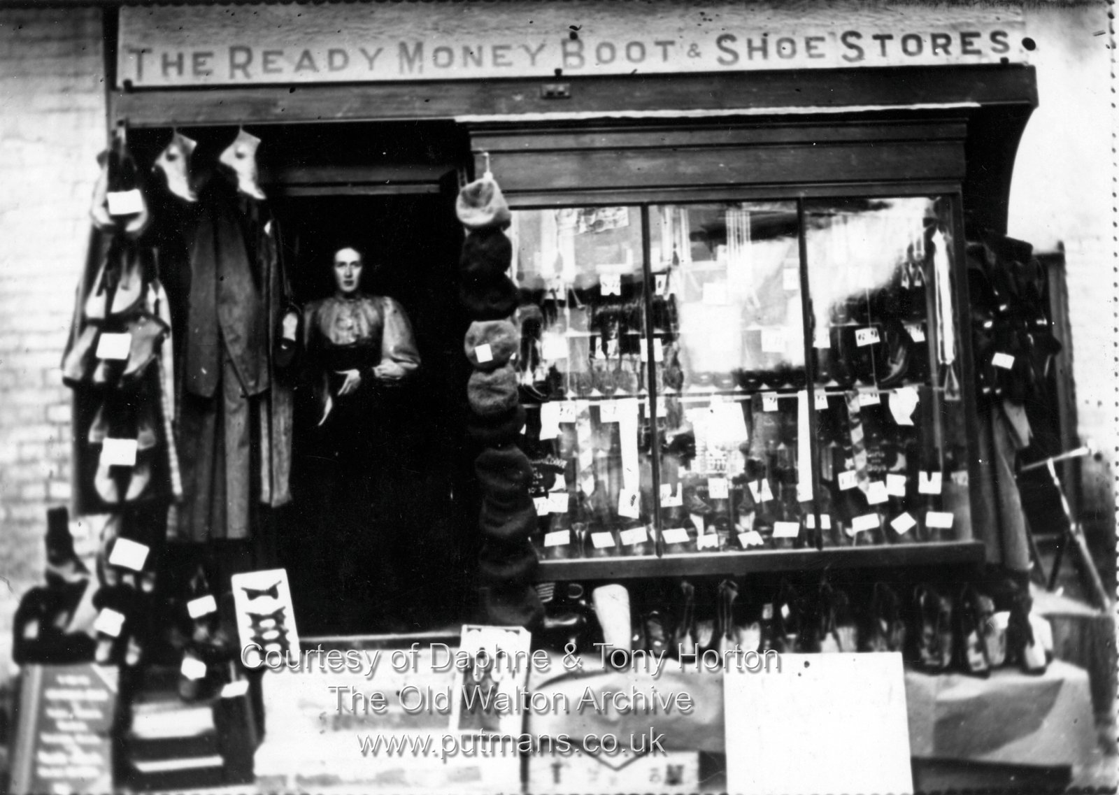 OK69 The Ready Money Boot & Shoe Store (Opposite the school)