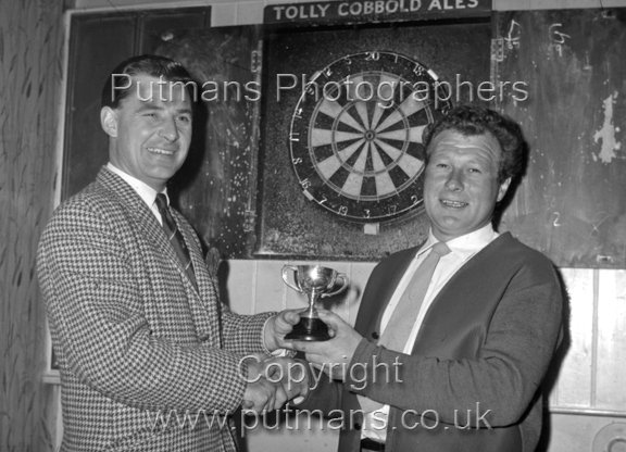 John Halls(lewft) presentation to RAFA Darts Captain Peter Mearns April 1967