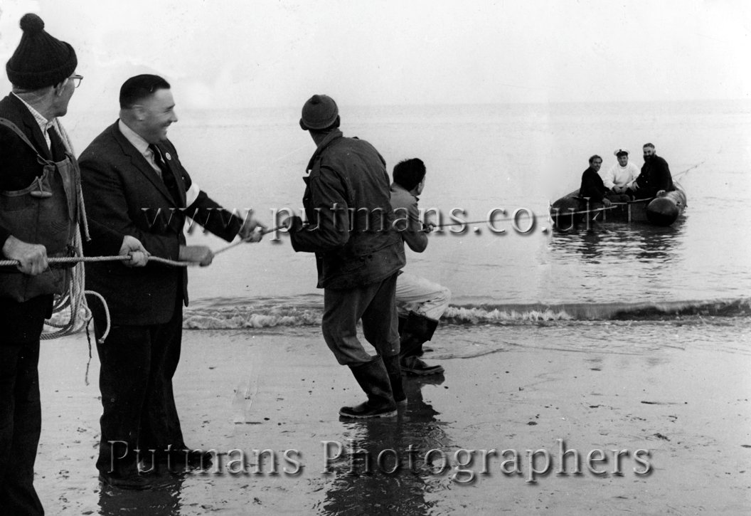 Life Saving Assoc practice. L to R: Bob Edmonds, Eric Brett, Len Lacey & Robin Tott. In boat: Bill Chaplin, Eric Hartley & Geoff Mills