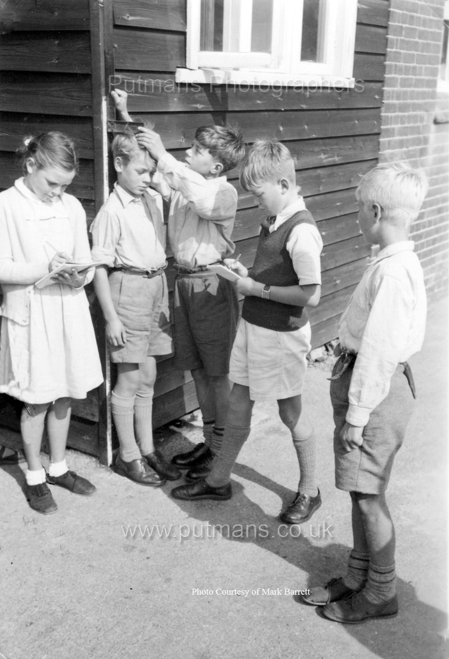Ref D7 Junior 4 boys measuring height of pupil c1955