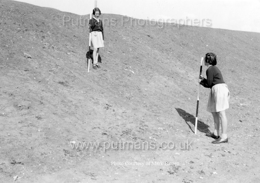 Ref E4 Measuring gradient of sea wall behind School Field c1955