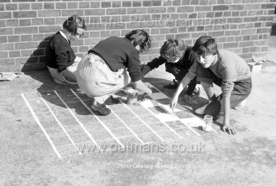 Ref F2 Junior 4 girls draw a draughtsboard on playground c1955