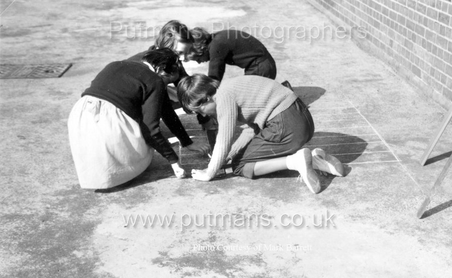Ref F3 Junior 4 girls draw a draughtsboard on playground c1955