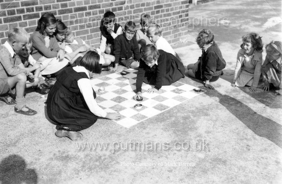 Ref F2 Junior 4 girls play draughts on playground c1955