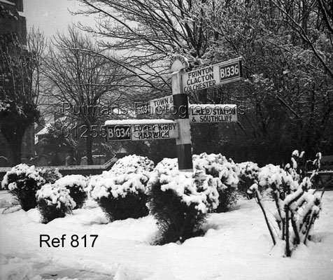 Ref 817 Road sign by church